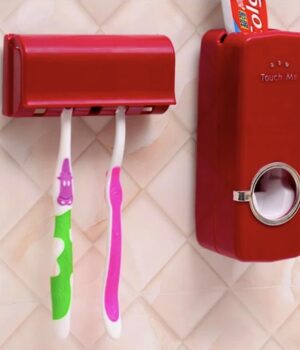TOOTHPASTE DISPENSER/BRUSH HOLDER