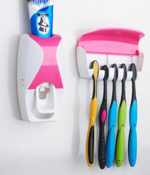 TOOTHPASTE DISPENSER/ BRUSH HOLDER